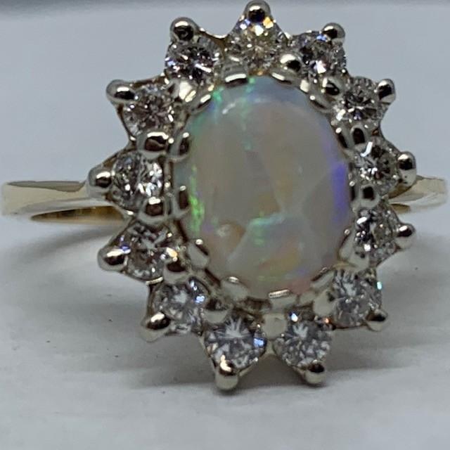 14KT YELLOW GOLD 1.75CTS OPAL AND .75CTS DIAMOND RING