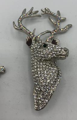 2 Rhinestone Stag Brooches; 2 Snowflake Brooches