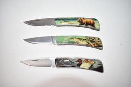 Three Folding Hunting Scene Knives with Display