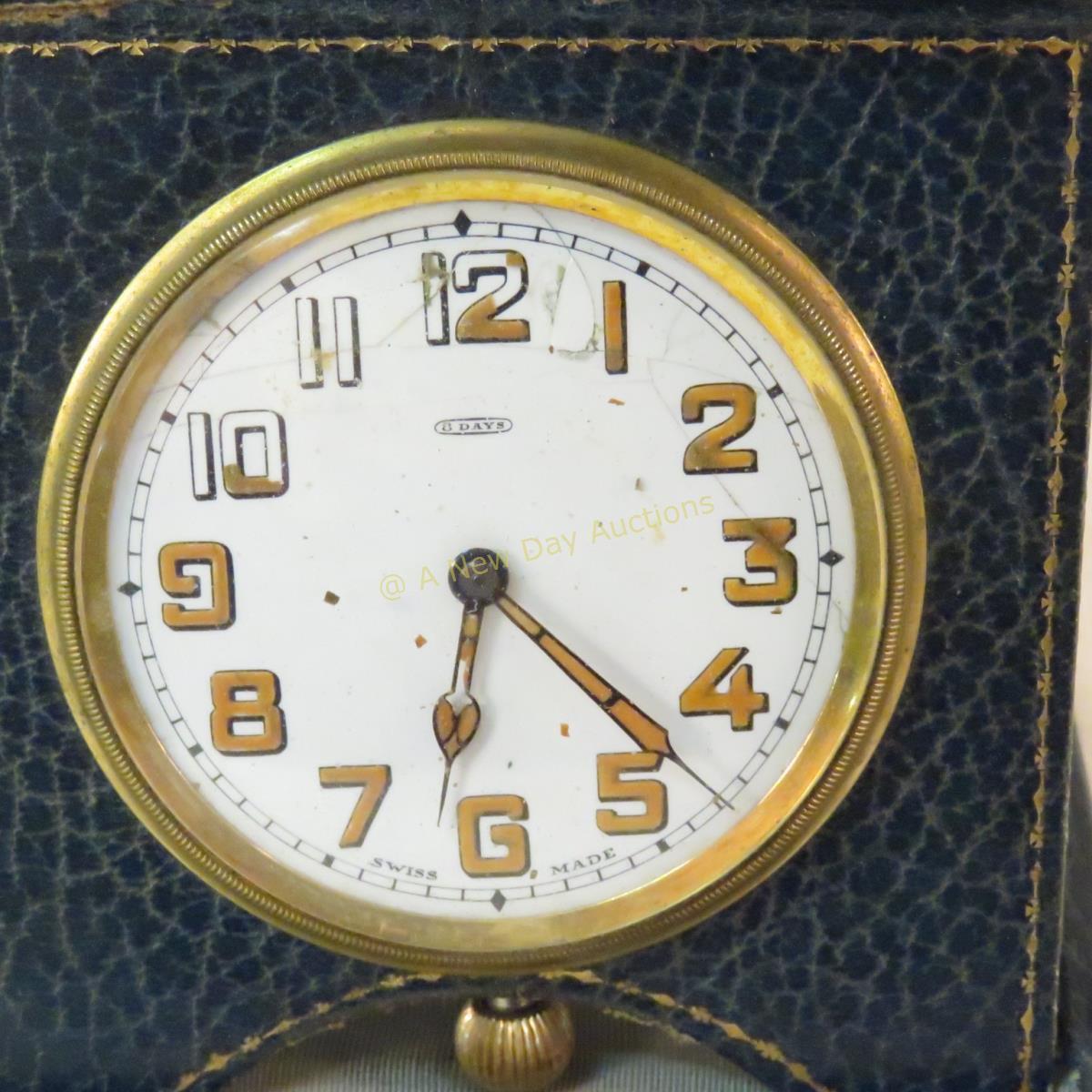 Vintage travel clock with leather case