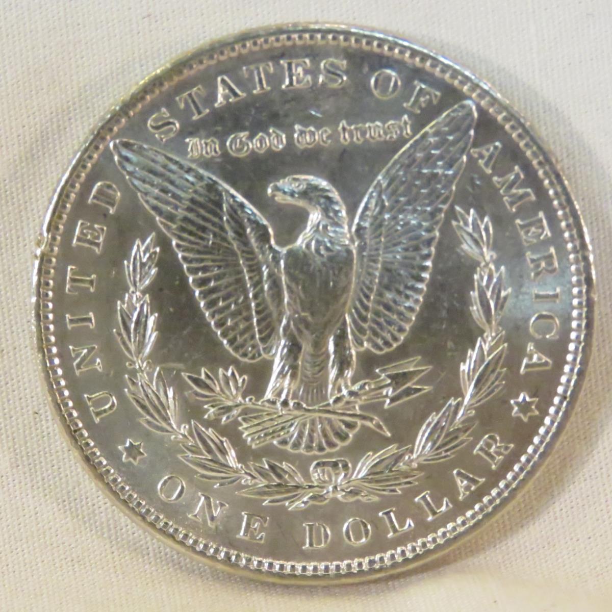 23 Morgan Silver Dollars 1878-1921 in book