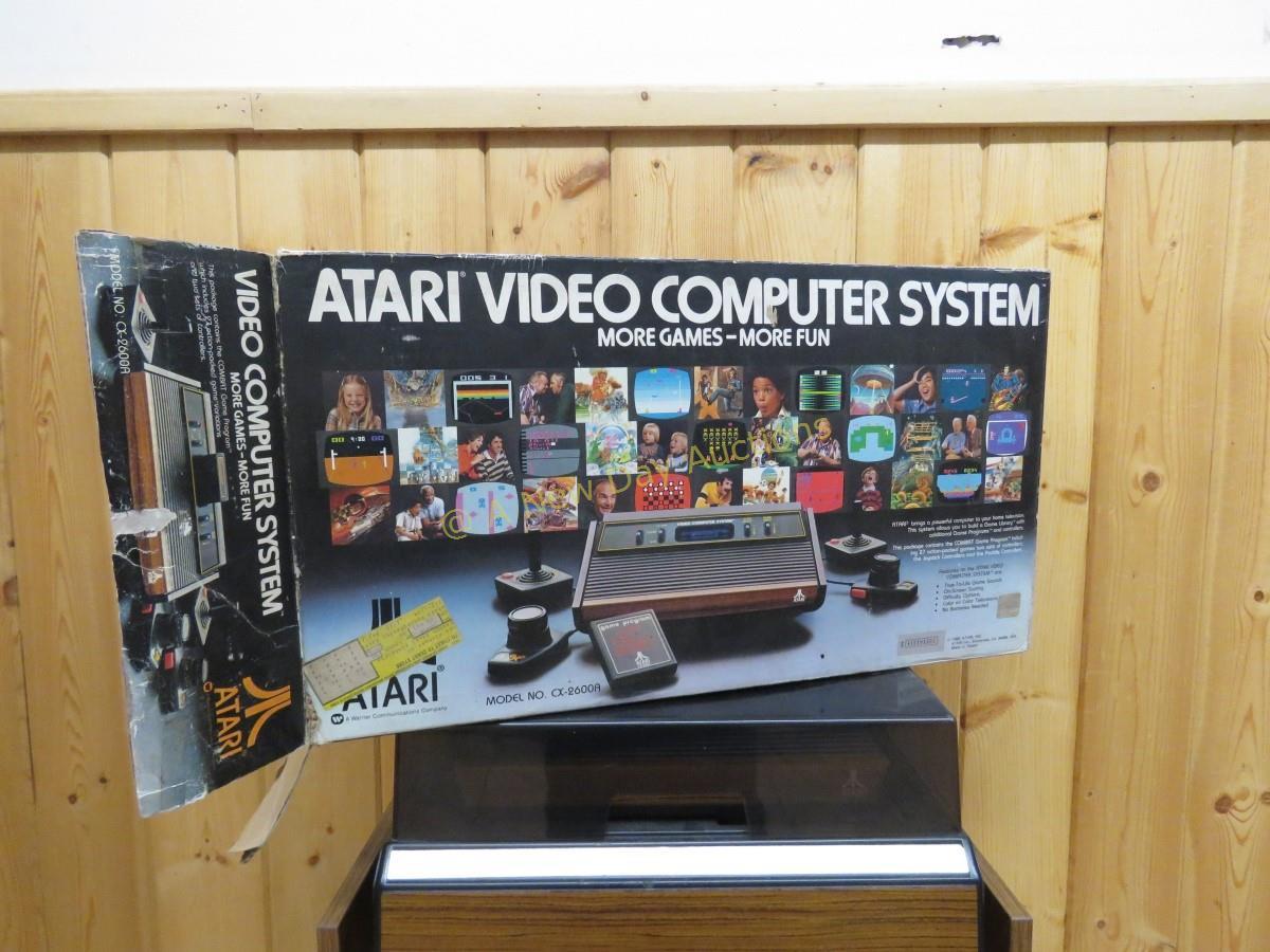 Atari console, controllers, 40 games with boxes