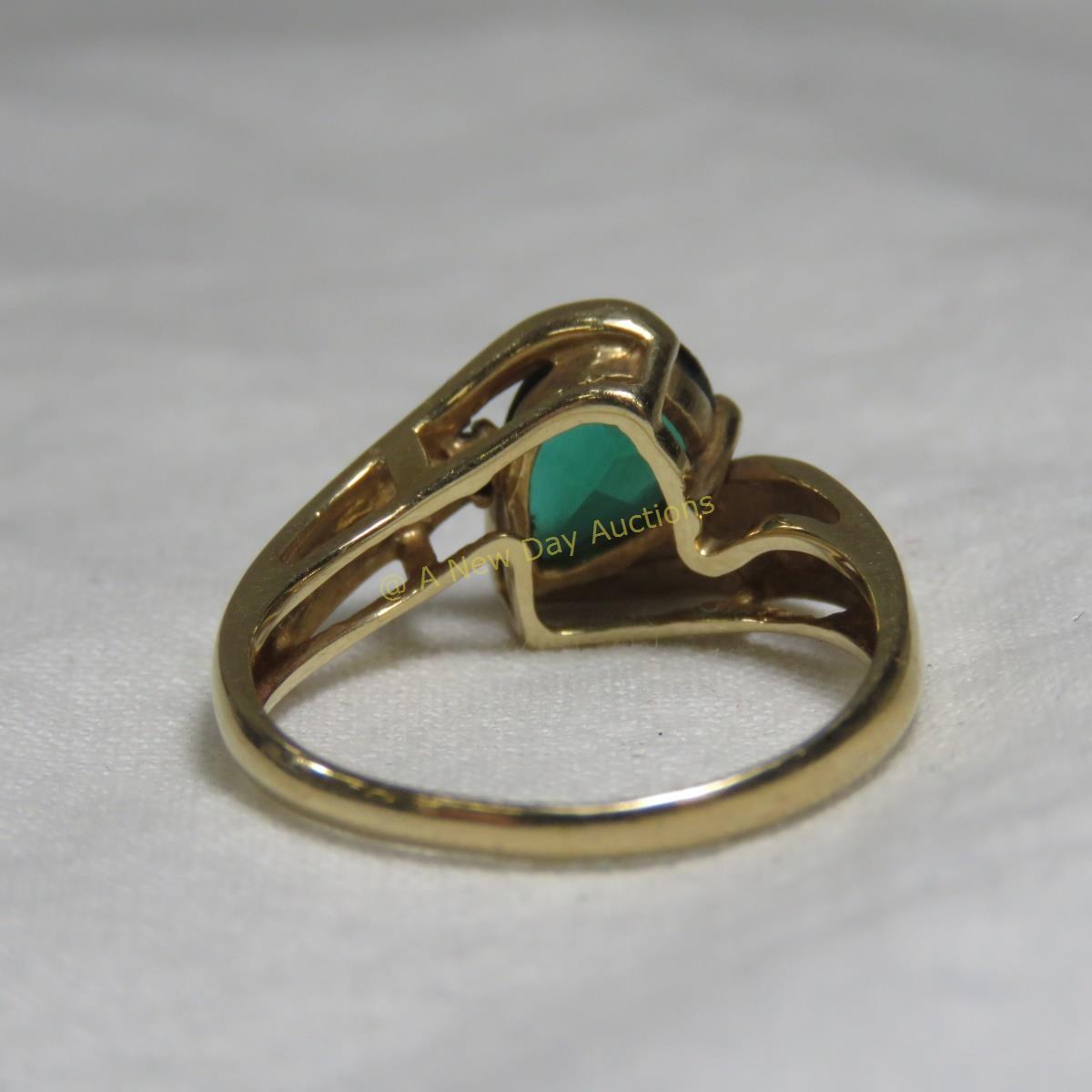 14kt gold ring with pear cut emerald & diamond