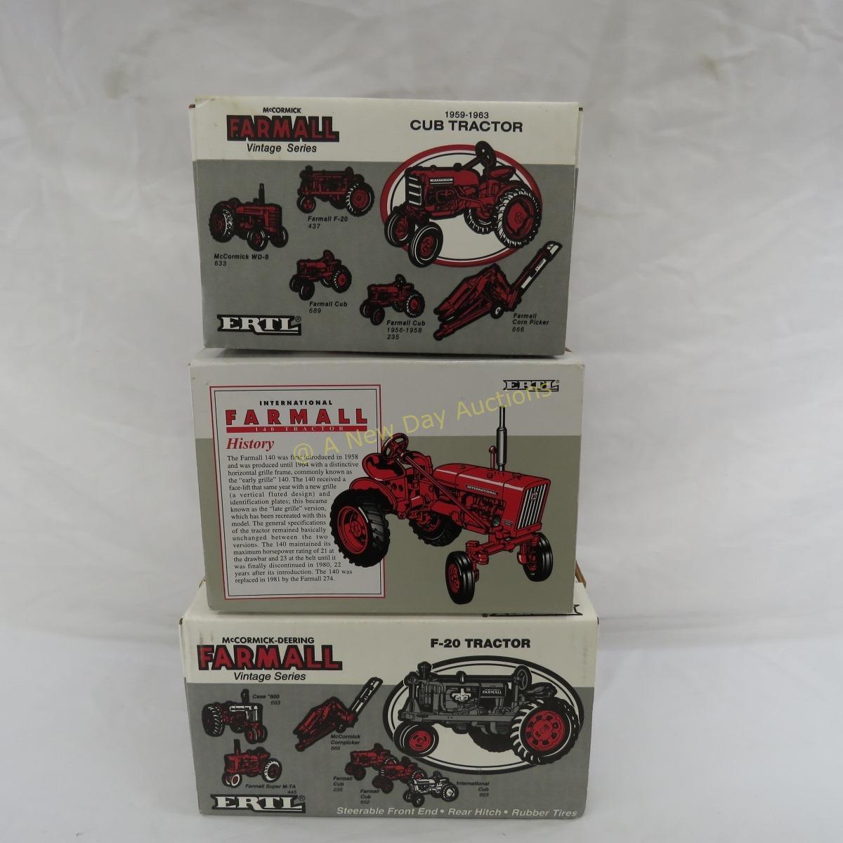 3 Ertl Farmall 1/16 scale tractors in boxes