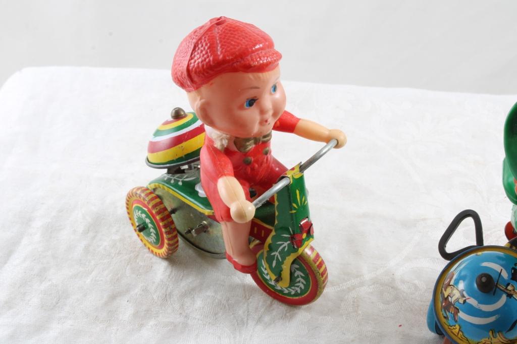 2 Wind Up Tin Toys Marx Cowgirl on Trike & Boy