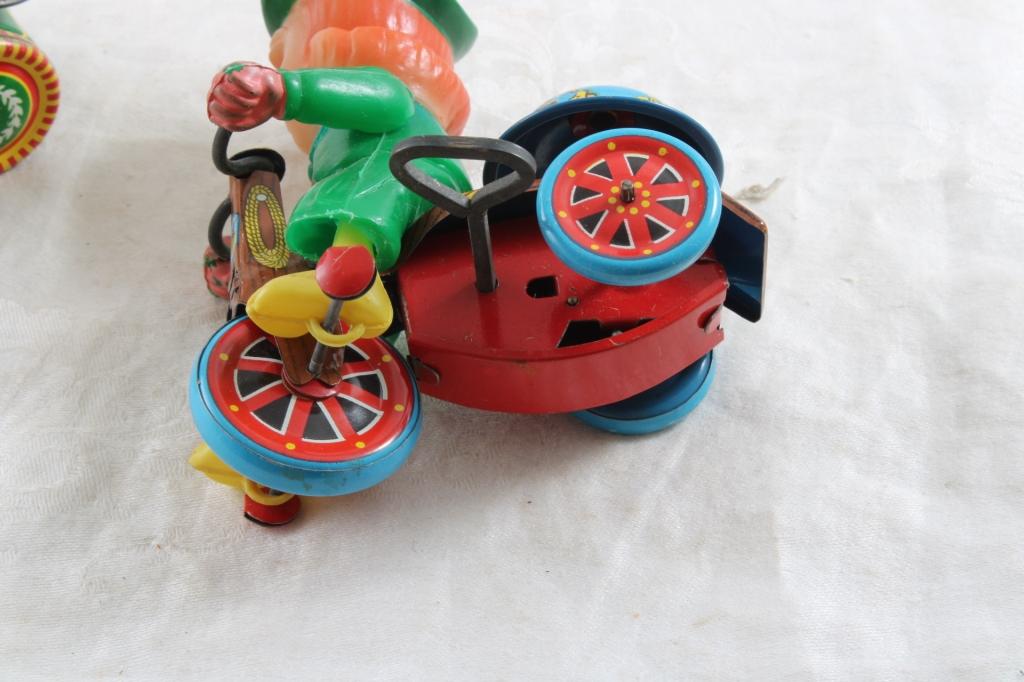 2 Wind Up Tin Toys Marx Cowgirl on Trike & Boy