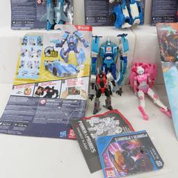 9 Transformers toys, some with Cards