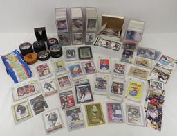 Collectible hockey cards and hockey pucks.