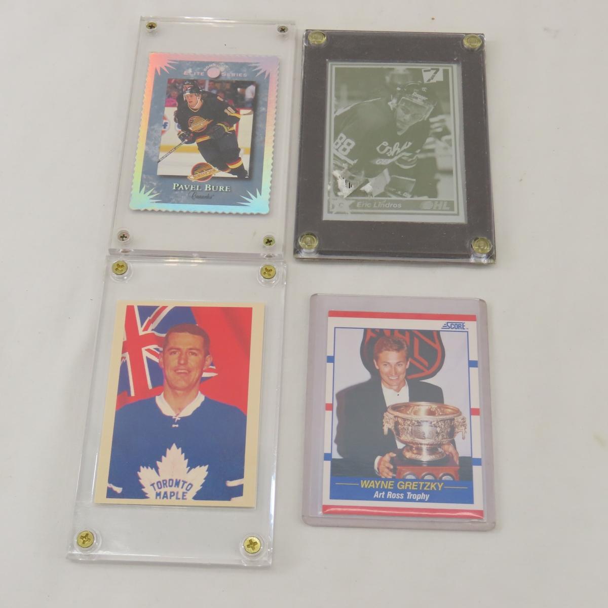 Collectible hockey cards and hockey pucks.