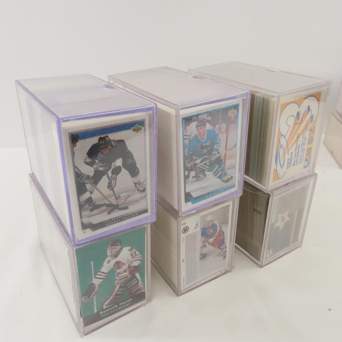 Collectible hockey cards and hockey pucks.