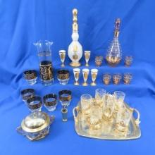 Three gold trim glass bar sets