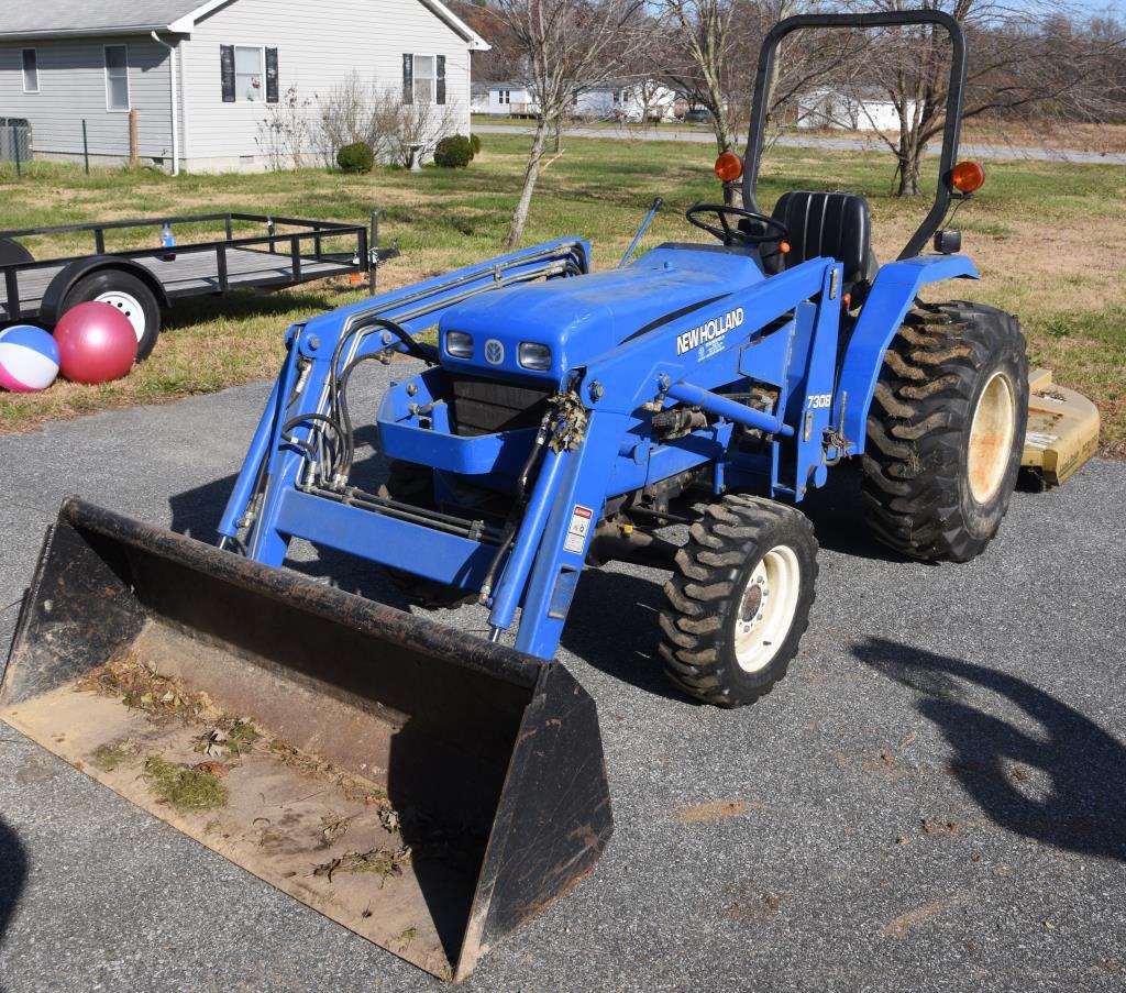 Lot # 5 - New Holland TC30 (Made from 2001-08)  garden tractor w/ 7308 front end loader, garage kept