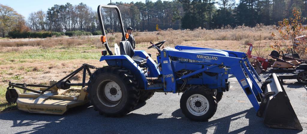 Lot # 5 - New Holland TC30 (Made from 2001-08)  garden tractor w/ 7308 front end loader, garage kept