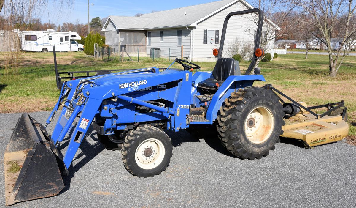 Lot # 5 - New Holland TC30 (Made from 2001-08)  garden tractor w/ 7308 front end loader, garage kept