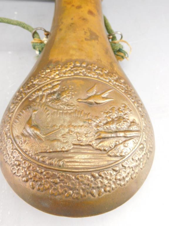 Lot #294 - Antique Brass shot flask with pheasant and flower motif 8”,