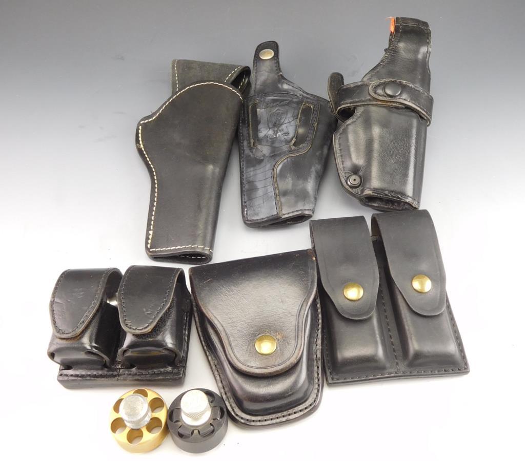 Lot #39 - (3) Leather Pistol Holsters, (1) leather belt mount hand cuff holder, (1)  Galls Gear