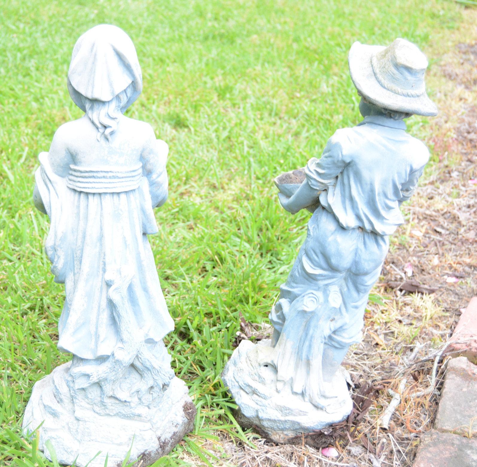 Lot #10 - Pair of Resin boy and girl garden statuaries 16” each