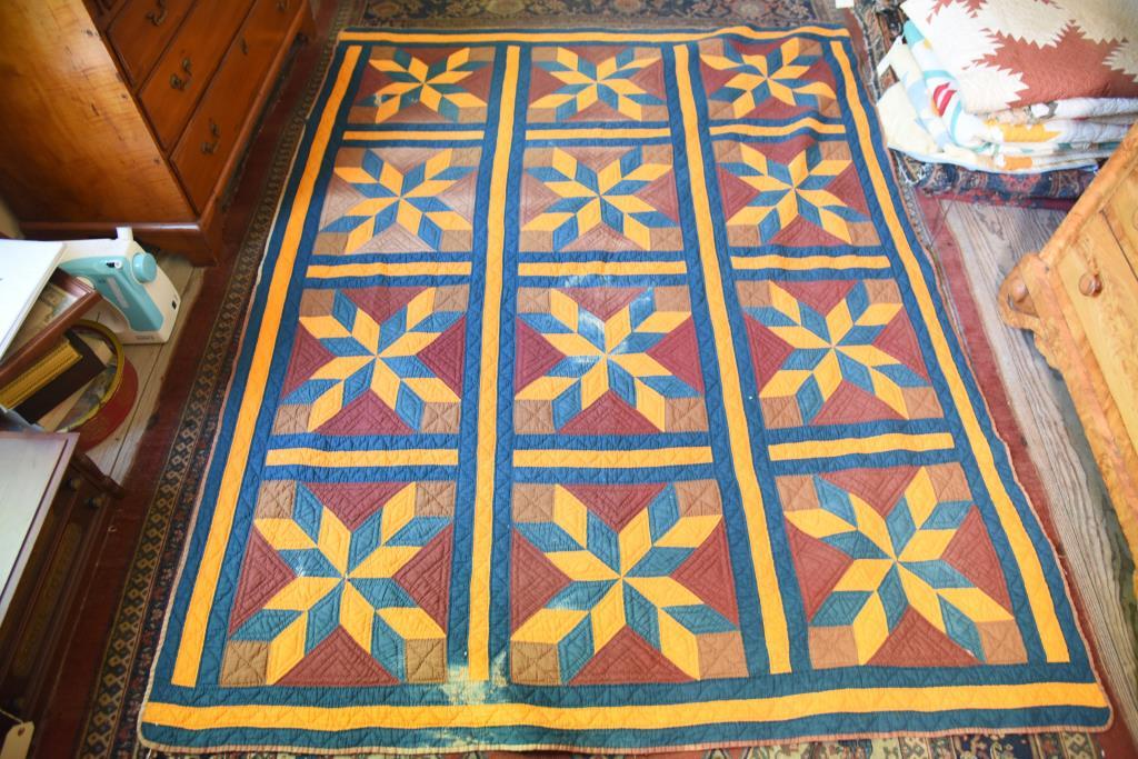 Lot #538 - Brilliant Golden Star pattern, blue maroon and gold pattern quilt 68” x 68” (few min