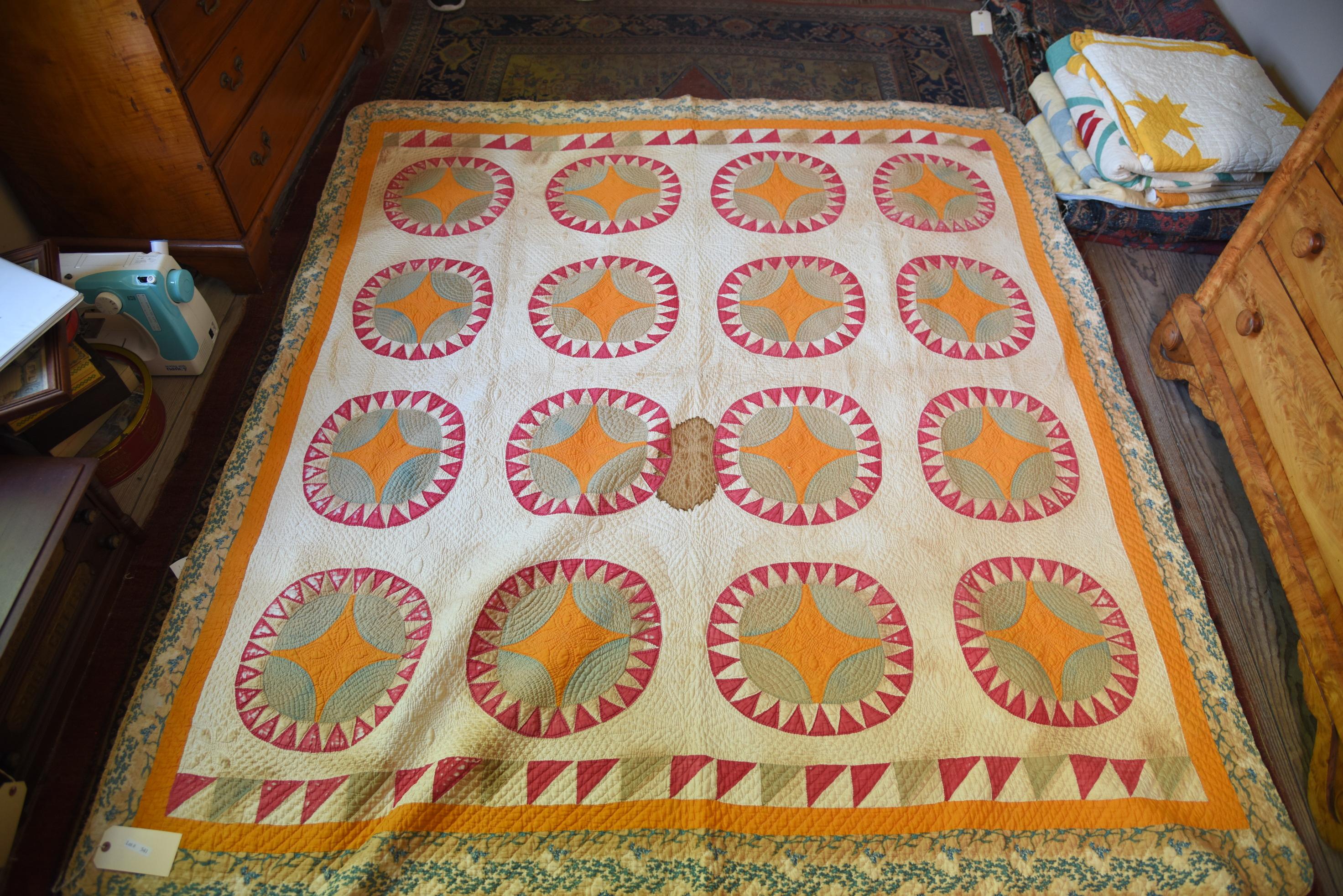 Lot #541 - Stitched applique sunflower pattern antique quilt circa 1840 some staining (quilt is