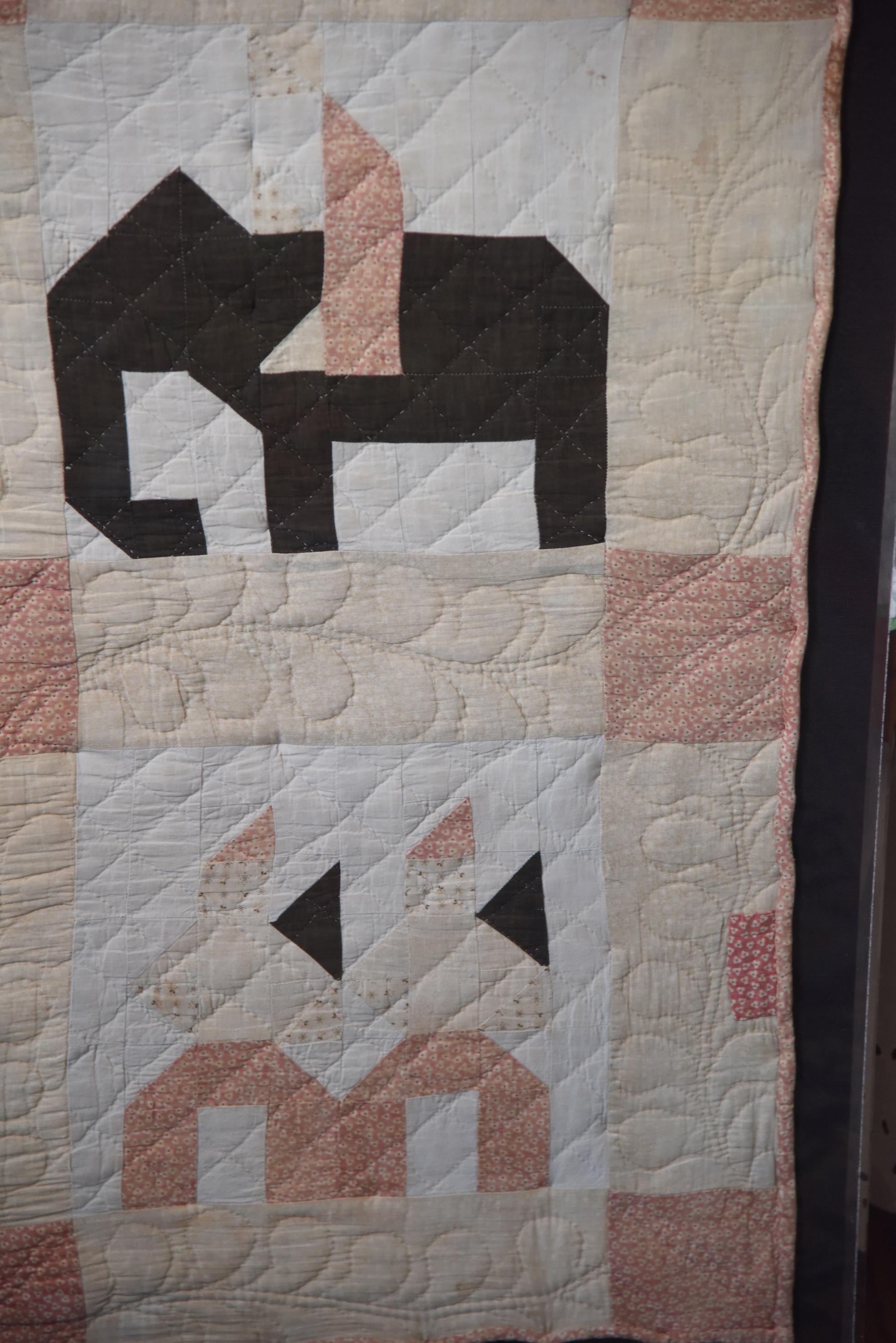 Lot #550A - American late 19th century figural applique and Pieced Crib Quilt in six 11” square