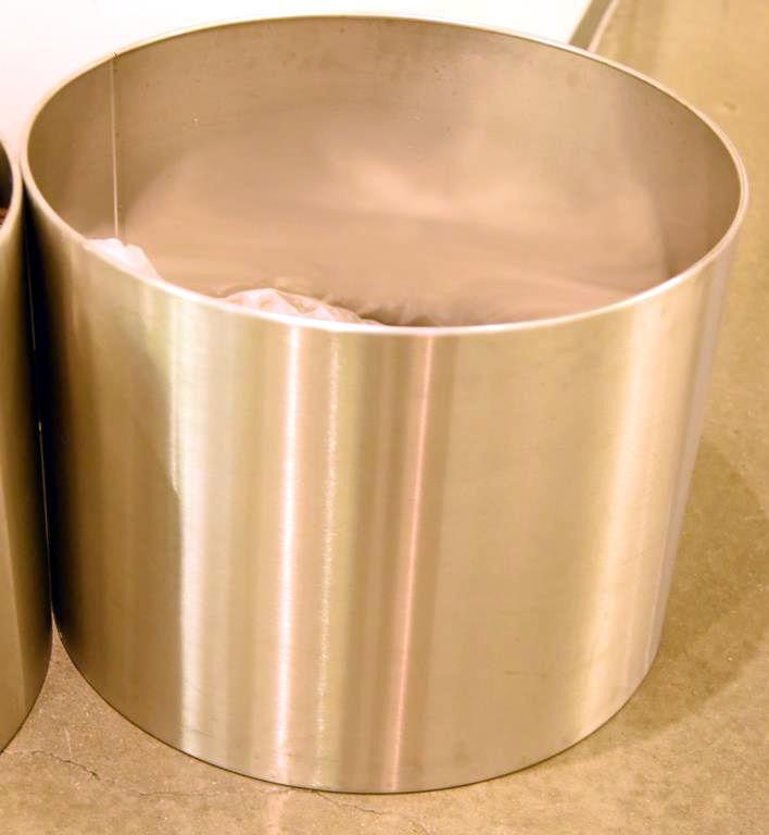 Lot #1251 -  Pair of stainless steel finish commercial grade indoor garden planters (18” x 23”)