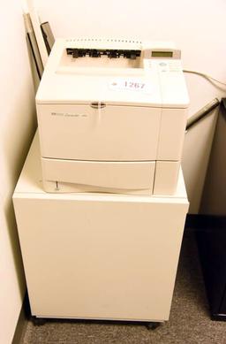 Lot #1267 - Hewlett Packard Laserjet 4000 printer with printer stand/cabinet and spare premium