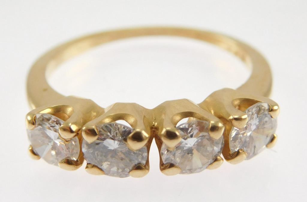 Lot #10: 14k yellow gold ladies 4 stone band (narrow 2mm half round shank/ 4-4 prong heads),