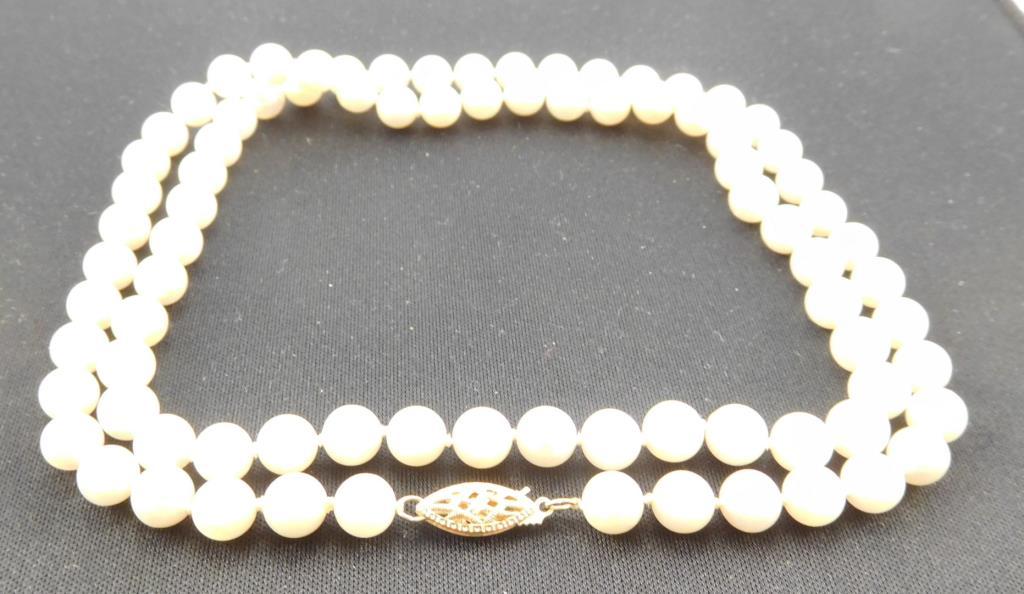 Lot #2: Ladies strand of uniform cultured pearls 24" in length, A- Quality with visual blemishes.