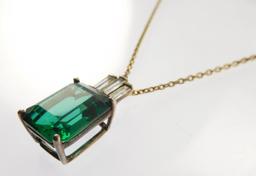 Lot #4: Sterling silver ladies 4 Prong pendant containing: a medium green rectangular synthetic