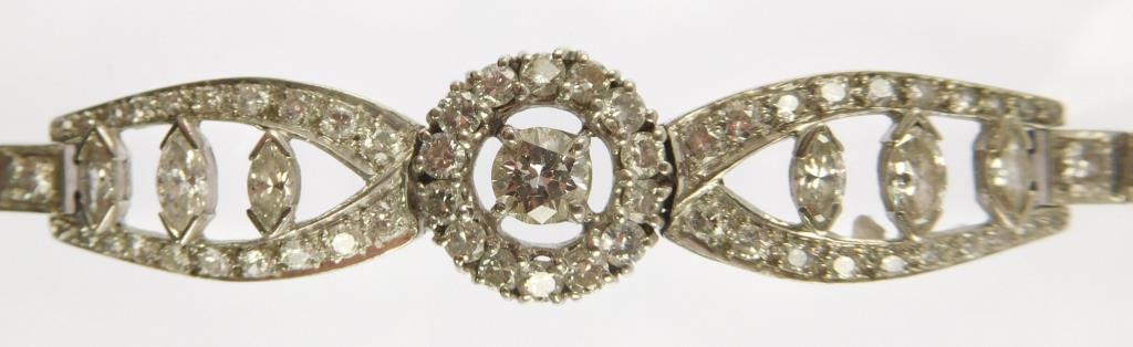 Lot #5: 10% iridium platinum link tennis bracelet (14mm circular cluster center piece/ 2 oval