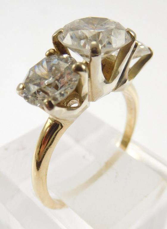 Lot #8: 14k ladies 3 diamond ring: (14k yellow gold narrow half round shank/ 3 - 14k white gold