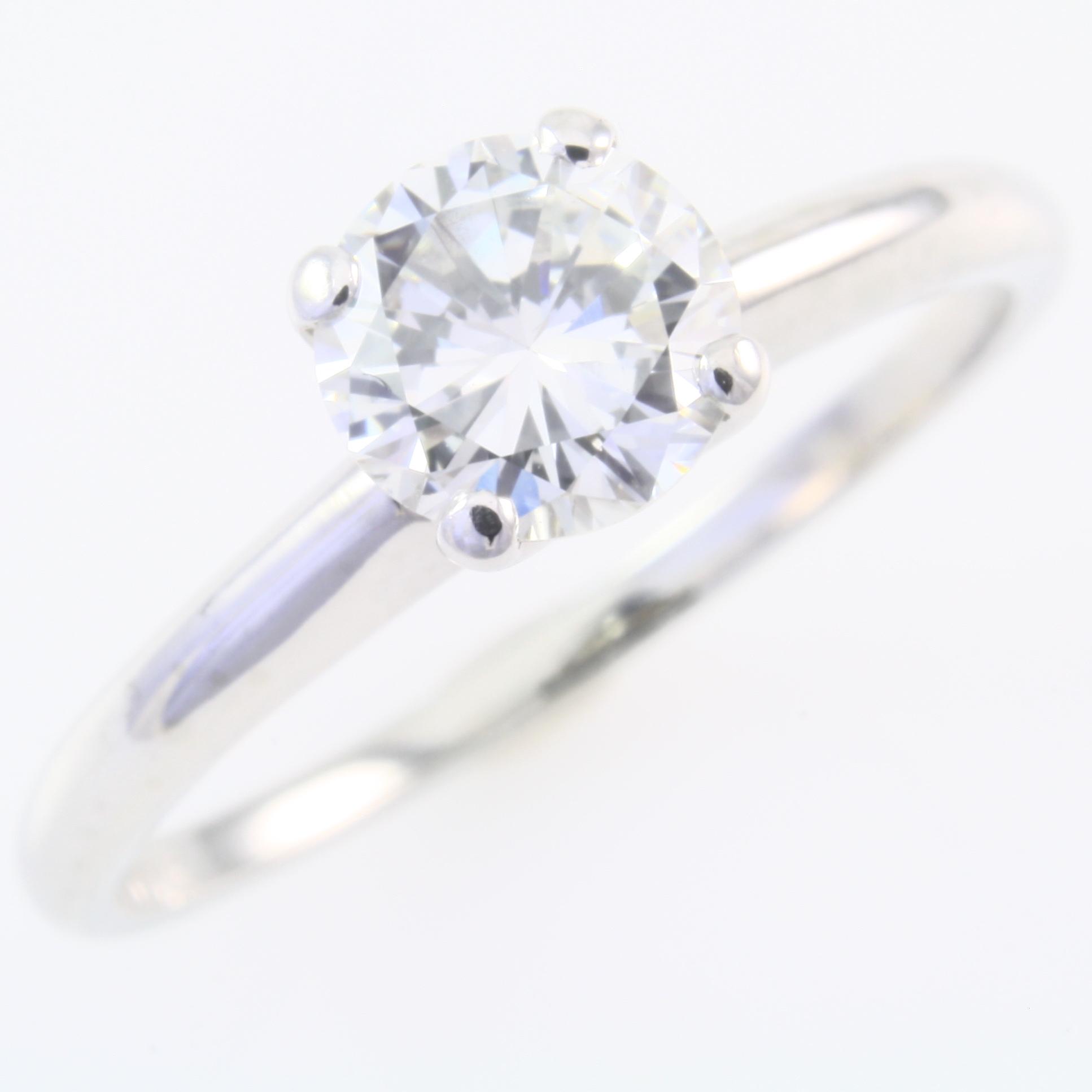 Estate 18K white gold diamond solitaire ring