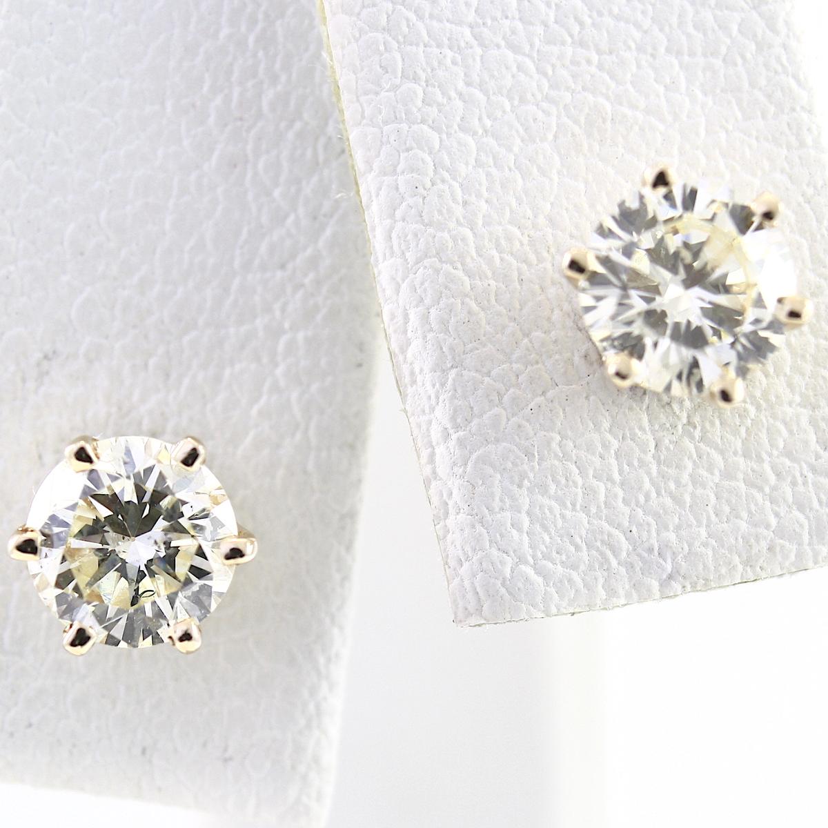 Pair of estate 14K yellow gold diamond stud earrings