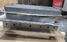 Steel stock plates 14x12x1 1/14", 15x12x1 1/4", two 13x14x2" with holes
