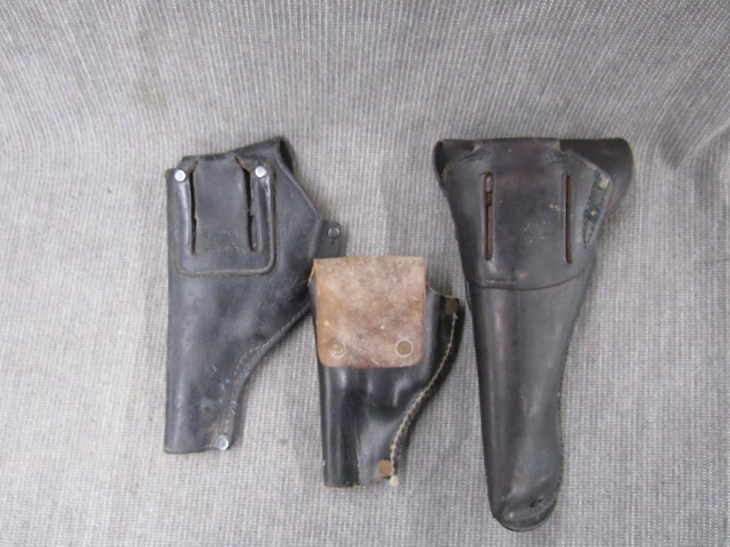 3 leather holsters.