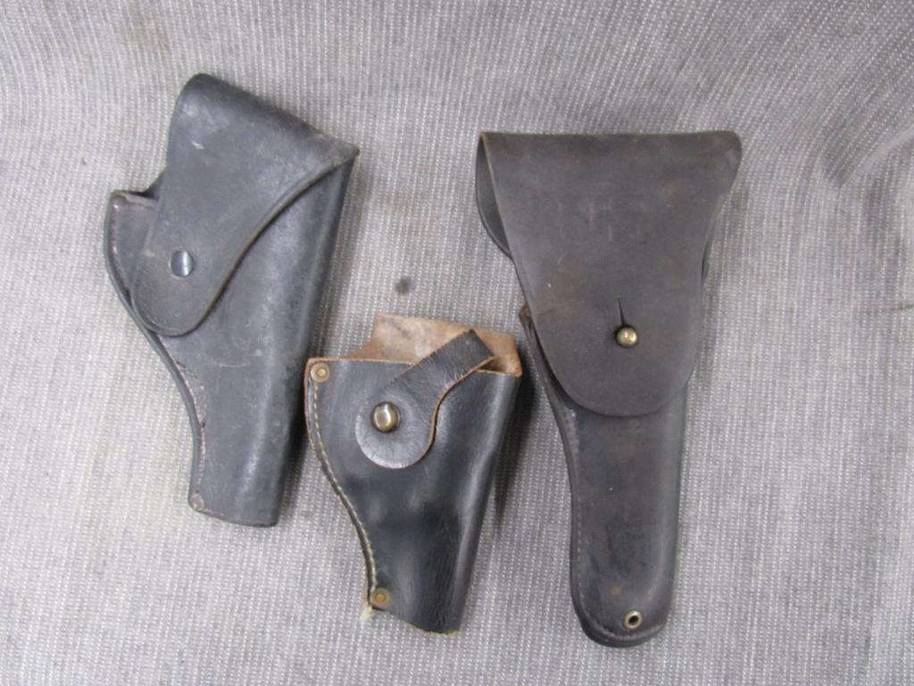 3 leather holsters.