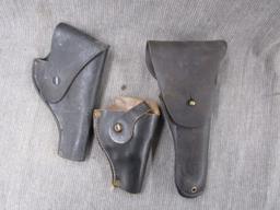 3 leather holsters.
