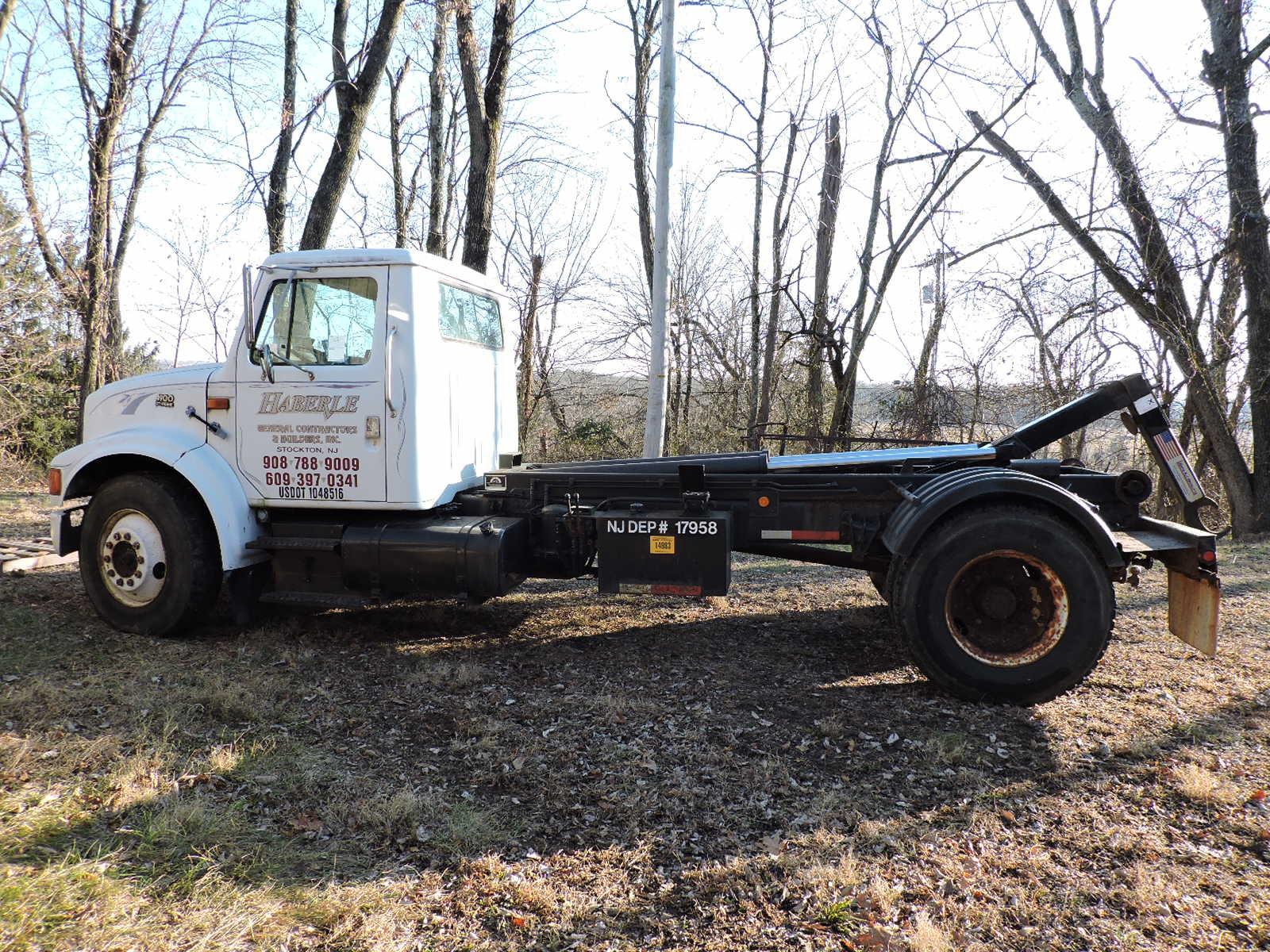 1997 International 4900 Regular Cab - Roll-Off / Hook Truck - with 3 Dumpsters & Flat Bed