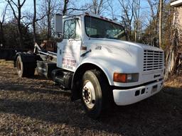 1997 International 4900 Regular Cab - Roll-Off / Hook Truck - with 3 Dumpsters & Flat Bed