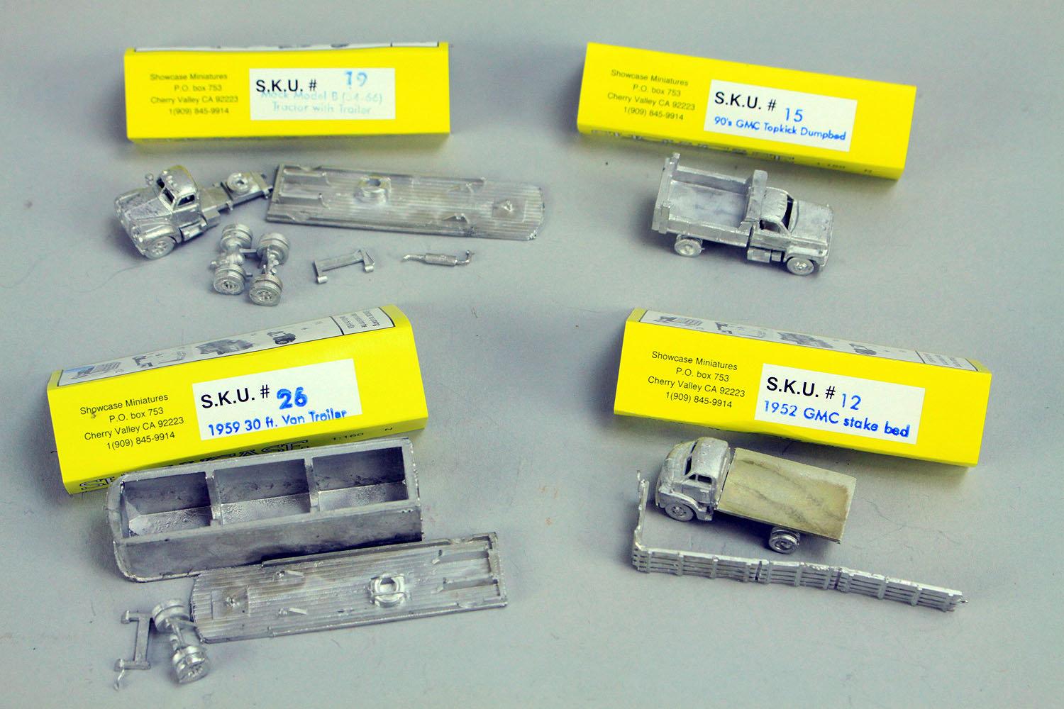 4 N Scale Showecase Miniatures; GMC Stake Bed SKU#12, GMC Topkick Dumpbed SKU#15, Mack Model B