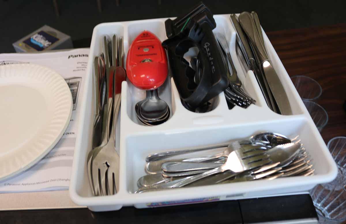 Assorted Household Items: Microwave, Flatware & More