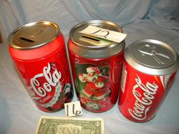 Coca Cola= Pair Of coca cola Cans that are coin Banks; Coaster Can.