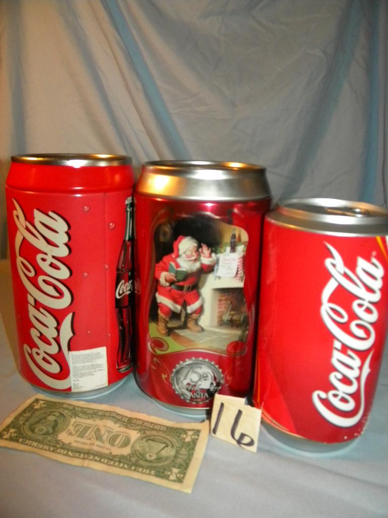 Coca Cola= Pair Of coca cola Cans that are coin Banks; Coaster Can.