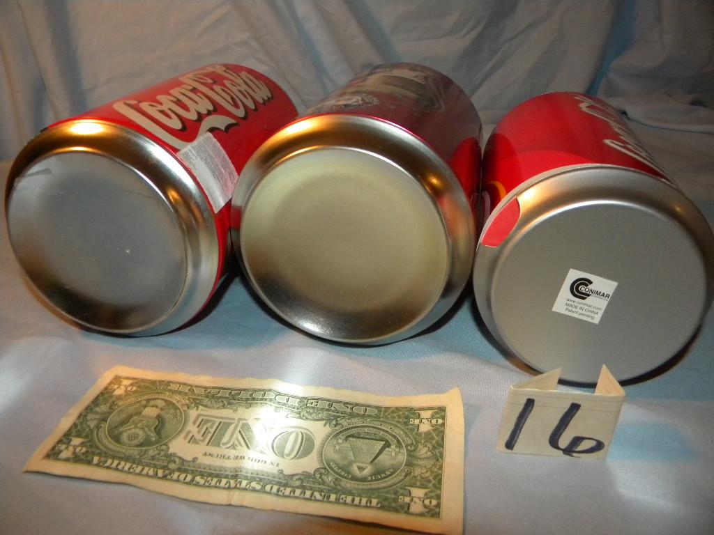 Coca Cola= Pair Of coca cola Cans that are coin Banks; Coaster Can.