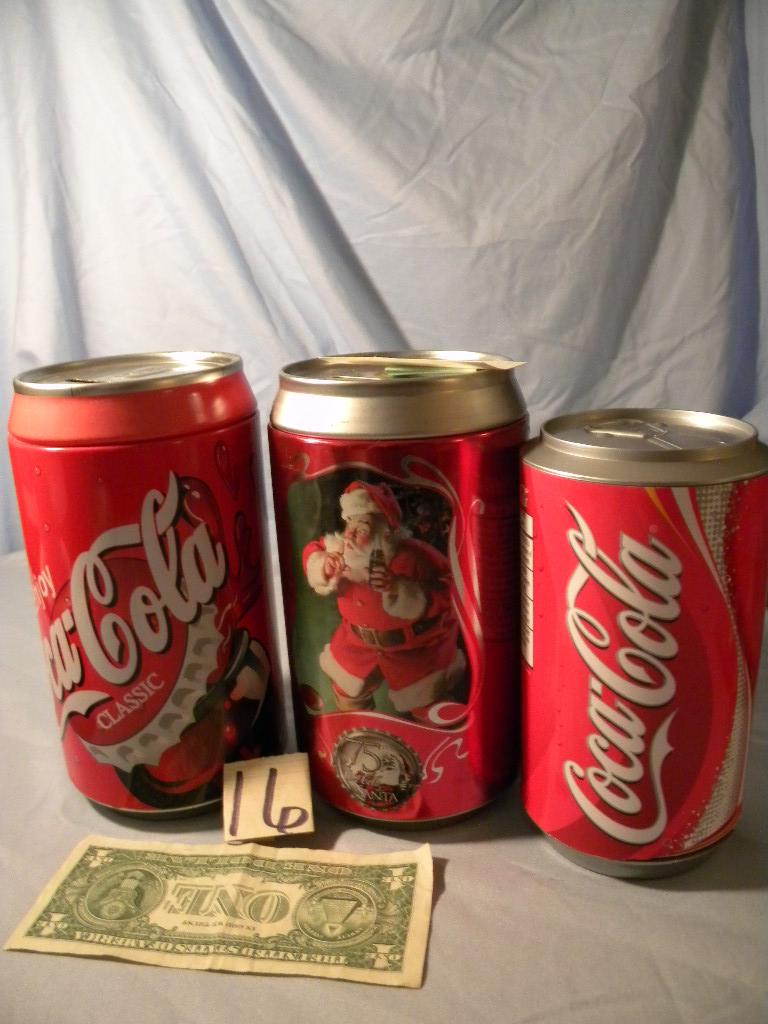 Coca Cola= Pair Of coca cola Cans that are coin Banks; Coaster Can.