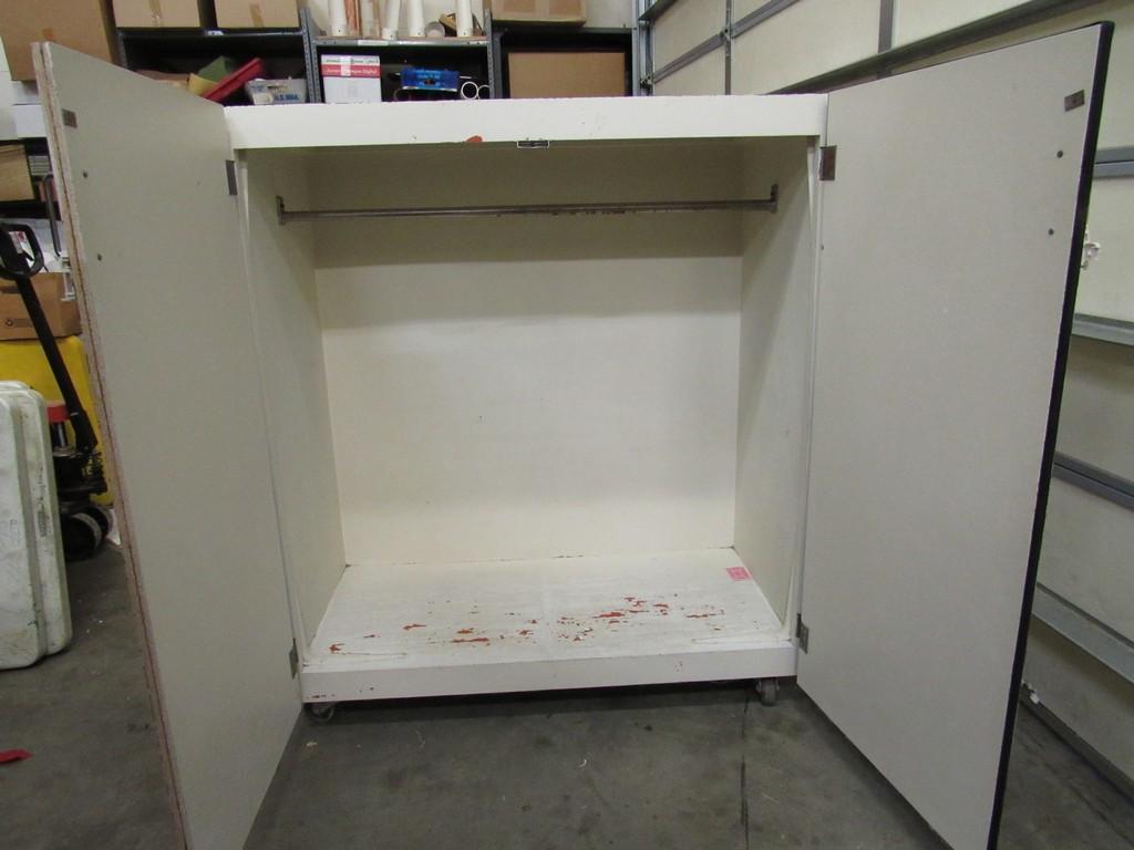 Wooden white cabinet on casters