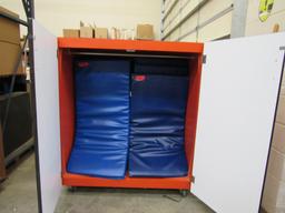 Red cabinet on casters w/rest mats