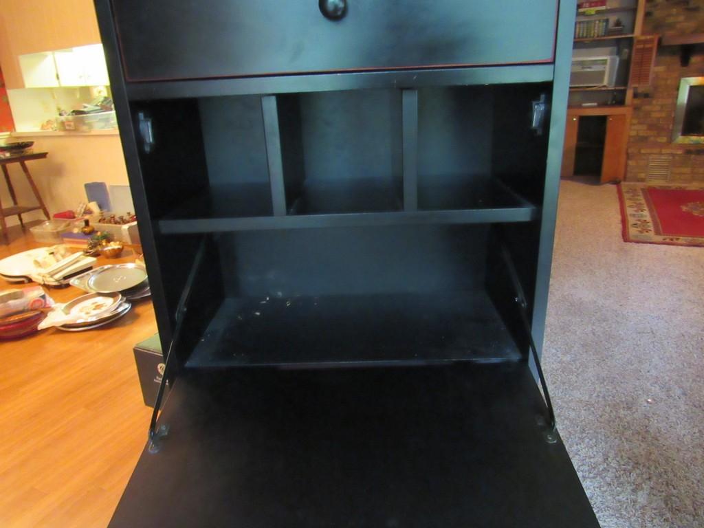 Black wooden secretary with contents