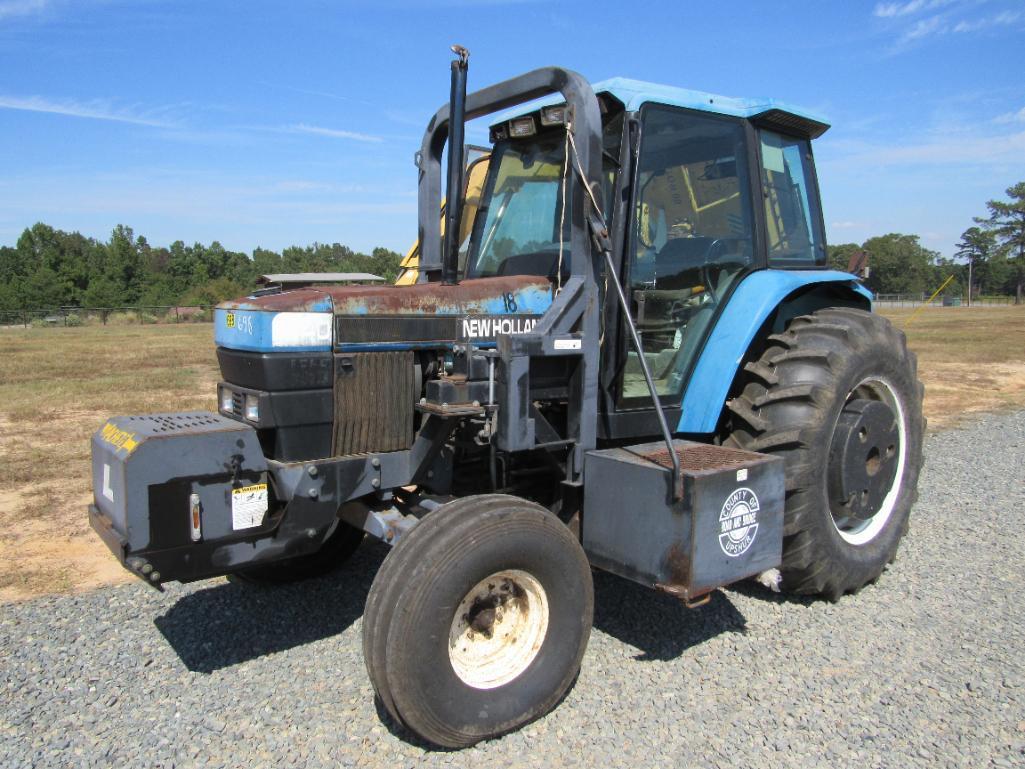 New Holland 7740 tractor w/Alamo side boom