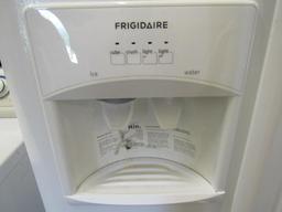 Frigidaire side by side refrigerator/freezer Mdl FFHS2311LWRA. with ice maker, water and ice in the